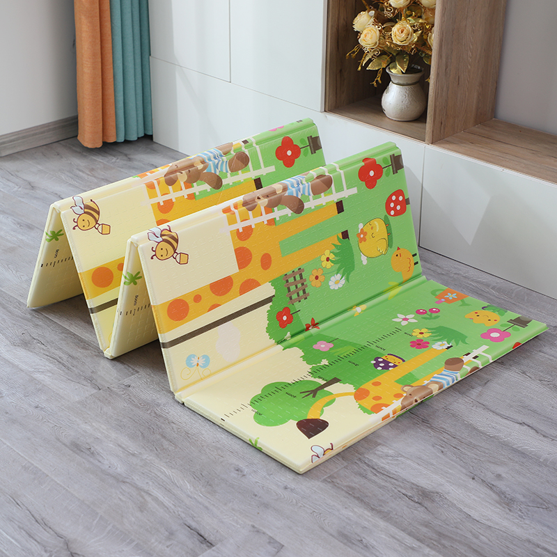 Baby playing safely on a non-toxic floor mat